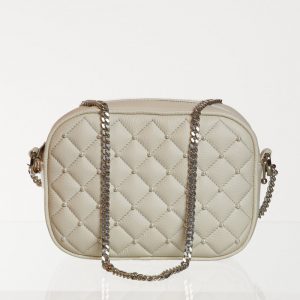 Quilted cream shoulder bag with pearl studs and chain strap